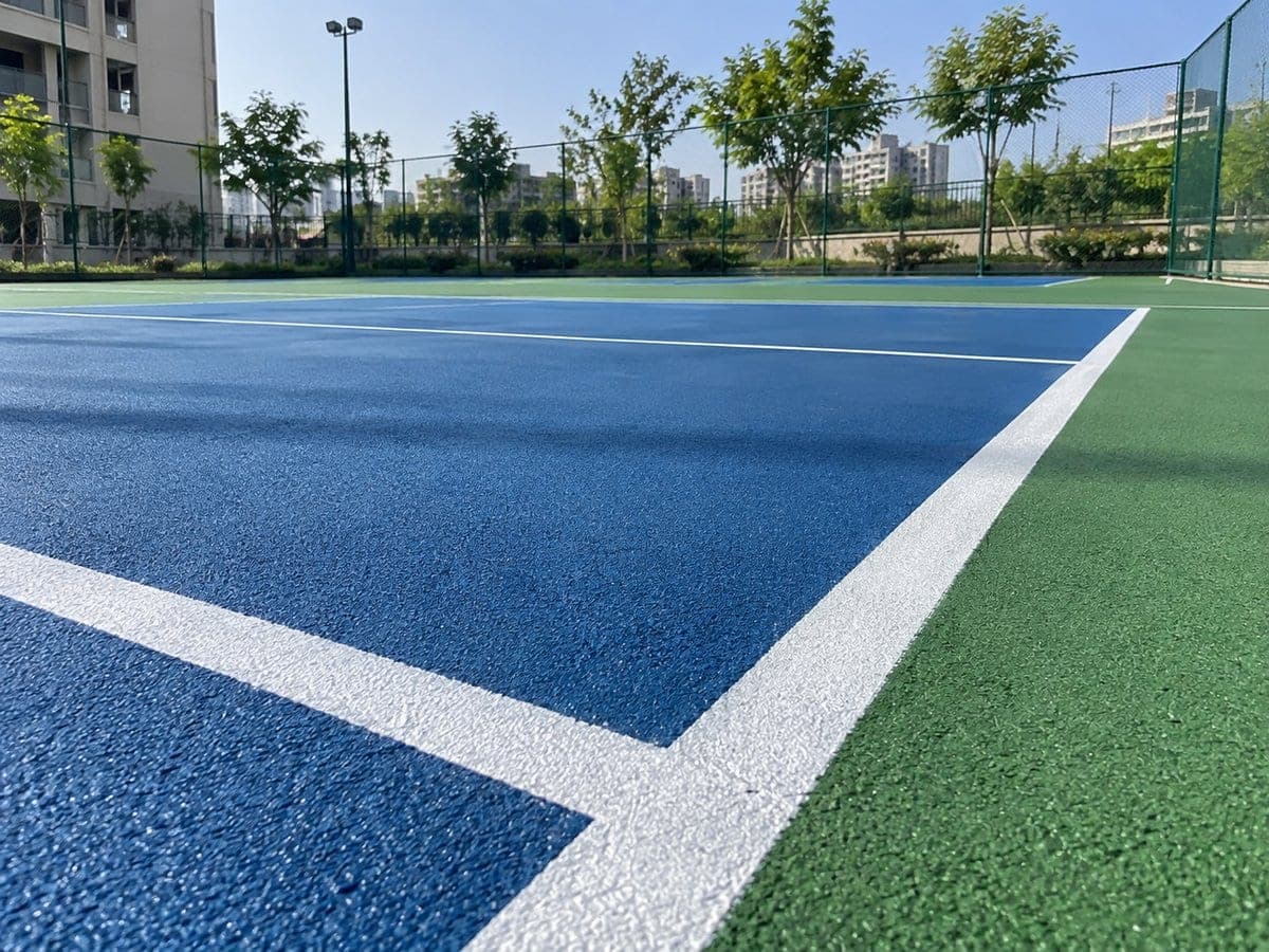 Synthetic painted sports flooring